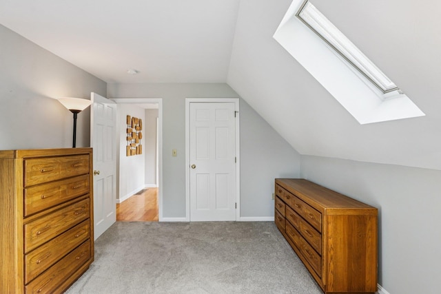 2 Warton Rd, Nashua, NH 03062 - additional living space featuring a skylight, lofted ceiling, light carpet, and baseboards