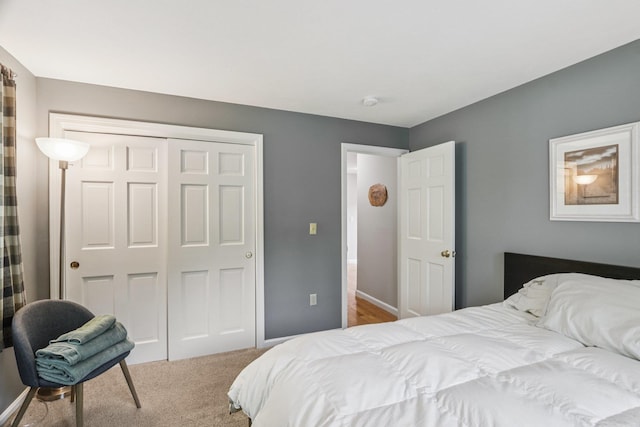 2 Warton Rd, Nashua, NH 03062 - carpeted bedroom featuring a closet and baseboards