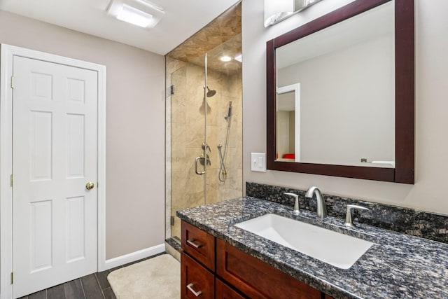2 Warton Rd, Nashua, NH 03062 - full bathroom featuring a shower stall, vanity, and baseboards