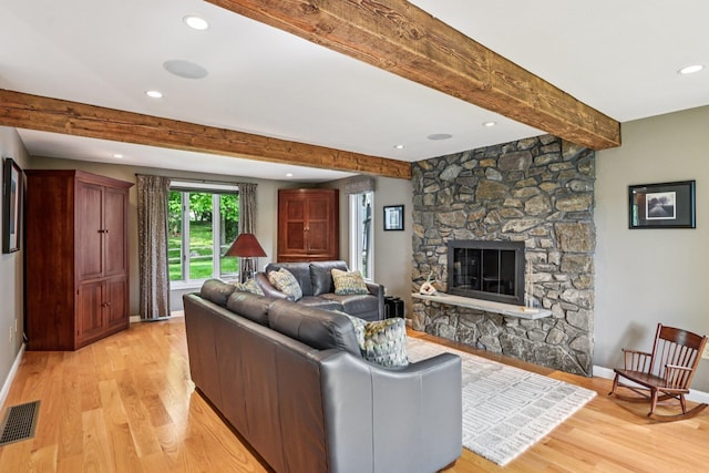 2 Warton Rd, Nashua, NH 03062 - living area with light wood-style flooring, beamed ceiling, recessed lighting, baseboards, and a fireplace