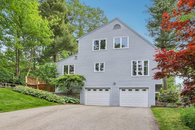 2 Warton Rd, Nashua, NH 03062 - view of home's exterior with an attached garage, driveway, and a lawn