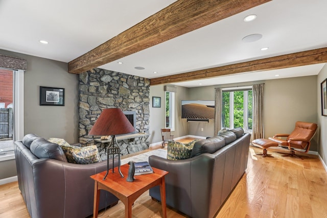 2 Warton Rd, Nashua, NH 03062 - living room featuring light wood finished floors, baseboards, beamed ceiling, a stone fireplace, and recessed lighting