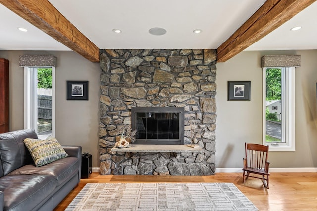 2 Warton Rd, Nashua, NH 03062 - living area featuring wood finished floors, beamed ceiling, a stone fireplace, baseboards, and recessed lighting