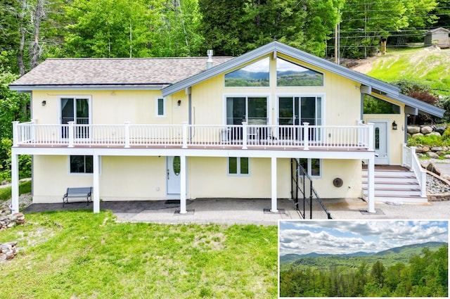 33 Karwendal Strasse, Bartlett, NH 03812 - back of property with a patio area, a lawn, and roof with shingles