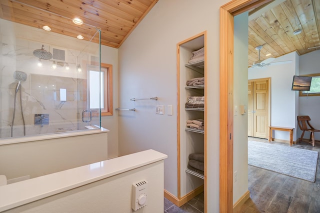 33 Karwendal Strasse, Bartlett, NH 03812 - bathroom featuring wooden ceiling, vaulted ceiling, a marble finish shower, a walk in closet, and baseboards