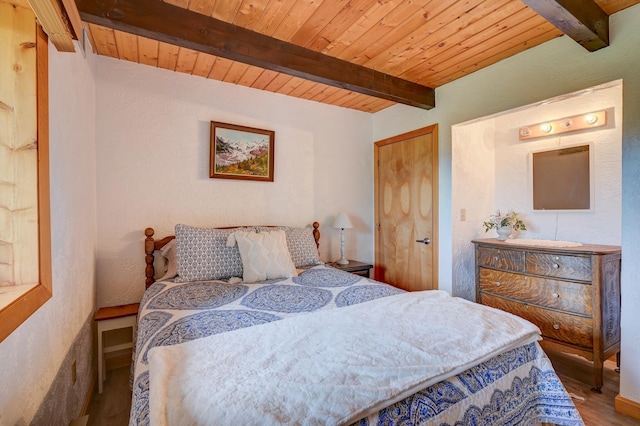 33 Karwendal Strasse, Bartlett, NH 03812 - bedroom with wood finished floors, wood ceiling with exposed beams, and a textured wall