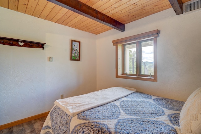 33 Karwendal Strasse, Bartlett, NH 03812 - bedroom with baseboards, wooden ceiling with exposed beams, and wood finished floors
