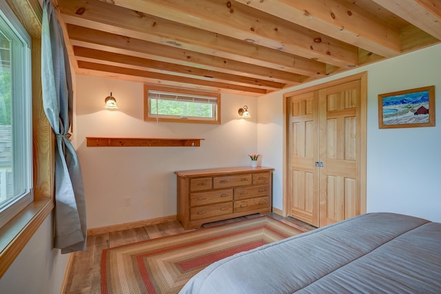 33 Karwendal Strasse, Bartlett, NH 03812 - bedroom with light wood-style flooring, beam ceiling, and baseboards