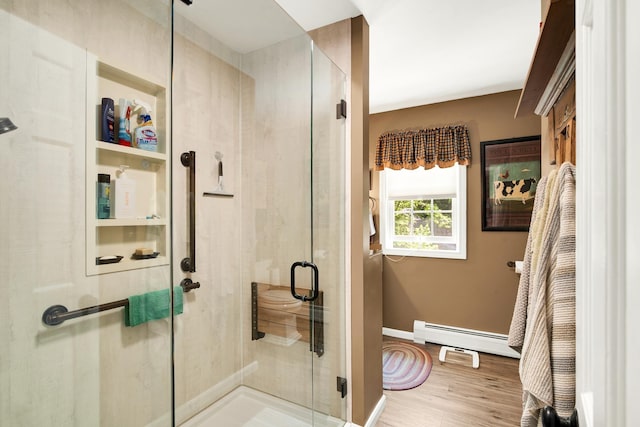 4 Mones Folly Dr, Dover, NH 03820 - full bath featuring a baseboard heating unit, a stall shower, baseboards, and wood finished floors