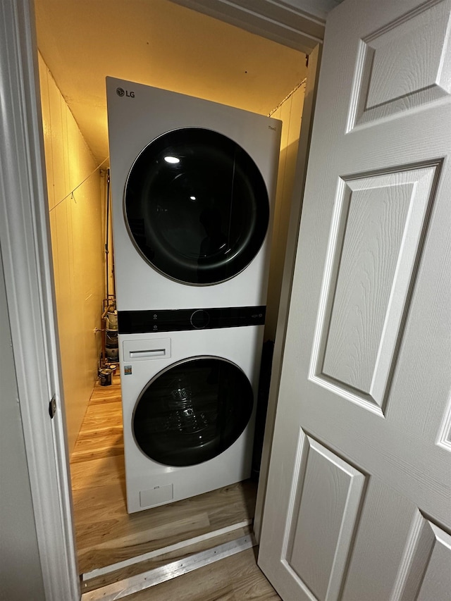 30 Flat Rock Bridge Rd, Rochester, NH 03868 - washroom with stacked washer and clothes dryer and light wood-style flooring