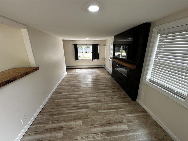 30 Flat Rock Bridge Rd, Rochester, NH 03868 - hallway with wood finished floors, baseboards, and baseboard heating