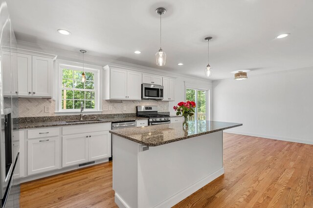 250 Harmony Rd, Northwood, NH 03261 - kitchen with appliances with stainless steel finishes, a sink, backsplash, white cabinetry, and recessed lighting