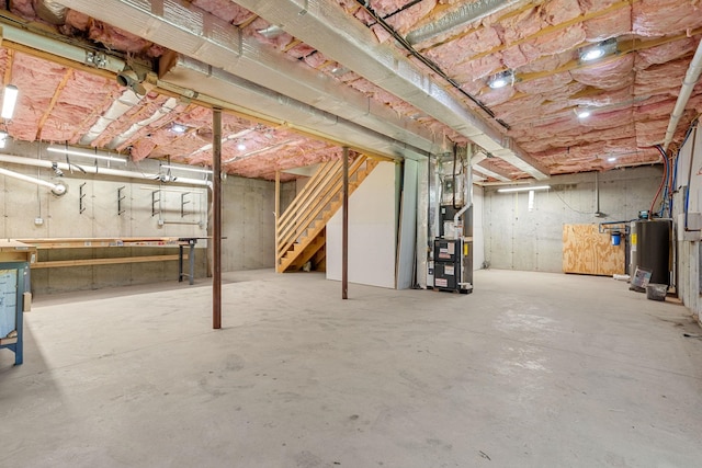 250 Harmony Rd, Northwood, NH 03261 - unfinished basement with heating unit, electric water heater, and stairs
