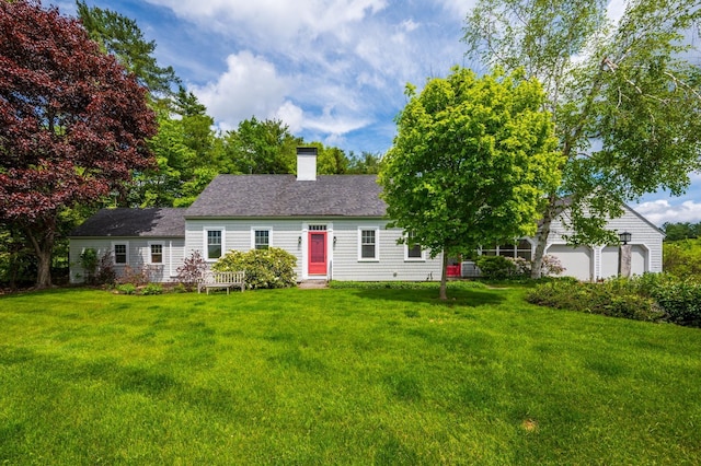 51 Carter Rd, New London, NH 03257 - view of front of home with a front yard, a chimney, and a garage