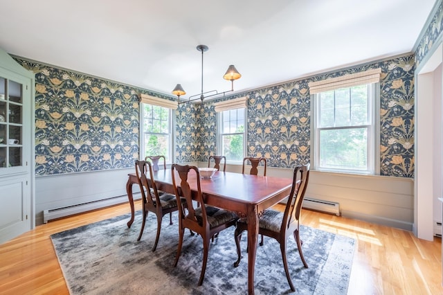 51 Carter Rd, New London, NH 03257 - dining room featuring wallpapered walls, a baseboard heating unit, a wainscoted wall, and light wood finished floors