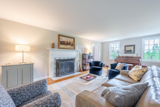 51 Carter Rd, New London, NH 03257 - living area featuring a tile fireplace, wood finished floors, and baseboards