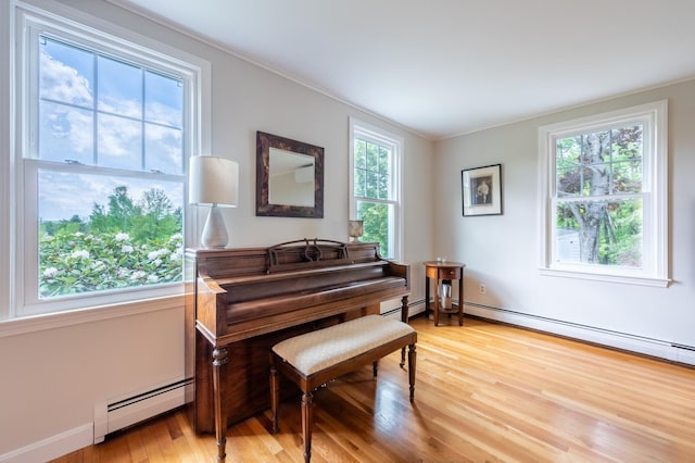 51 Carter Rd, New London, NH 03257 - sitting room with a baseboard radiator, plenty of natural light, light wood-style flooring, and ornamental molding
