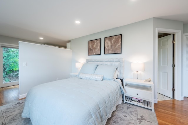 51 Carter Rd, New London, NH 03257 - bedroom with wood finished floors, recessed lighting, baseboards, and access to exterior