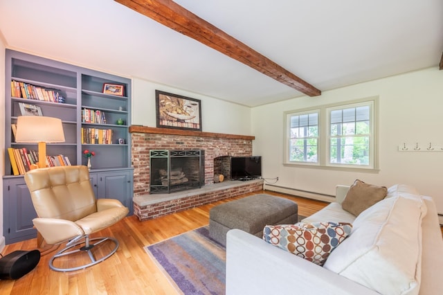 51 Carter Rd, New London, NH 03257 - living room featuring a baseboard heating unit, wood finished floors, beam ceiling, and a fireplace