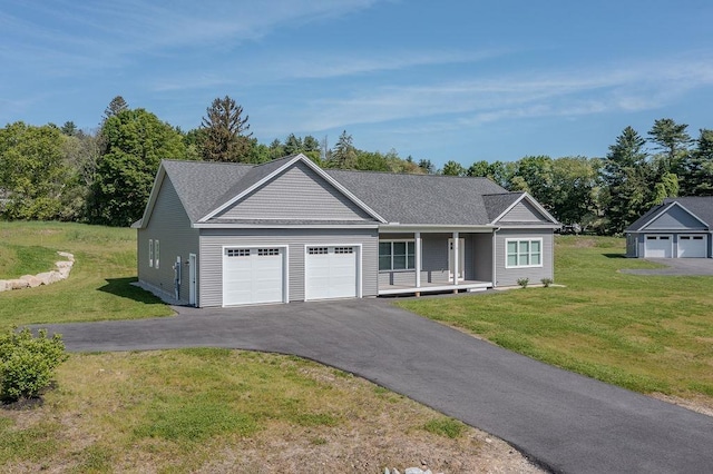 5 Midmark Ln, Concord, NH 03301 - ranch-style house with an attached garage, asphalt driveway, a front lawn, and a porch