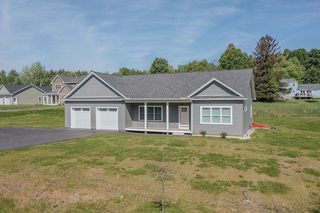 5 Midmark Ln, Concord, NH 03301 - ranch-style home with a garage, asphalt driveway, covered porch, and a front lawn