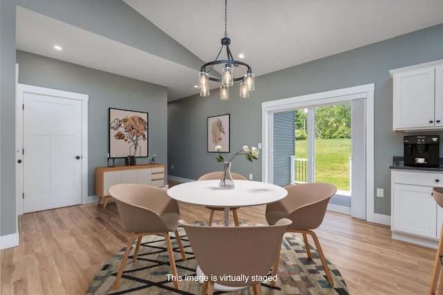 5 Midmark Ln, Concord, NH 03301 - dining area with light wood-style floors, vaulted ceiling, baseboards, and a chandelier