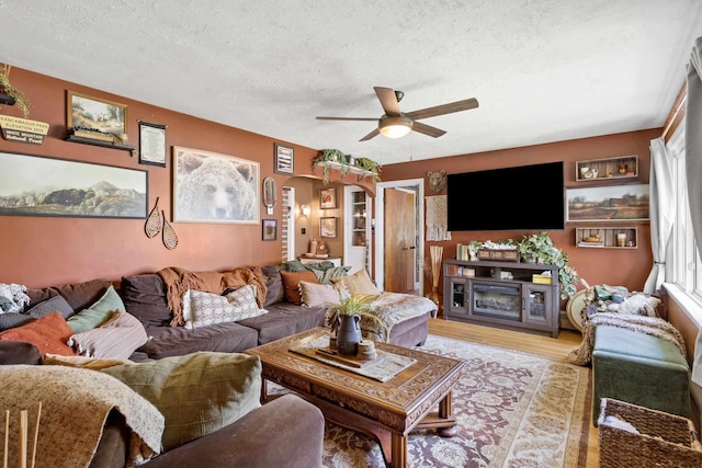 228 Platts Ave, Manchester, NH 03109 - living area featuring a textured ceiling, a ceiling fan, and light wood-type flooring
