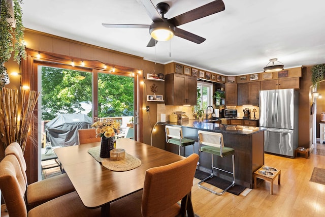228 Platts Ave, Manchester, NH 03109 - dining space with light wood-style flooring and ceiling fan