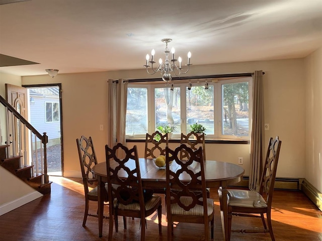 424 Main Dunstable Rd, Nashua, NH 03062 - dining space with a chandelier, dark wood finished floors, stairs, and baseboards