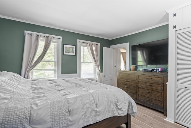 2124 Wakefield Rd, Wakefield, NH 03872 - bedroom with multiple windows, ornamental molding, and light wood-style flooring