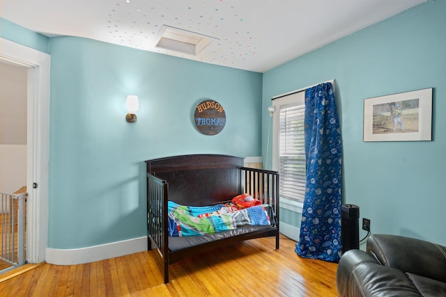2124 Wakefield Rd, Wakefield, NH 03872 - bedroom featuring wood-type flooring and baseboards