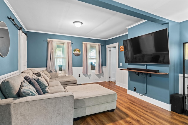 2124 Wakefield Rd, Wakefield, NH 03872 - living area featuring a barn door, a wainscoted wall, wood finished floors, and ornamental molding
