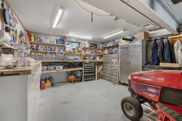 127 Shore Dr, Nashua, NH 03062 - garage featuring a workshop area
