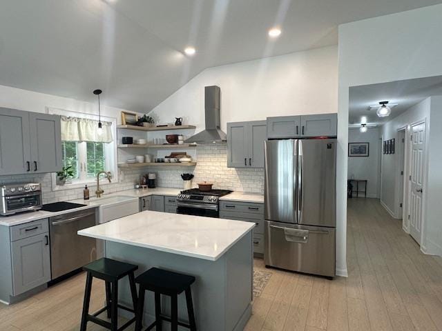 106 Betts Rd, Rochester, NH 03867 - kitchen with appliances with stainless steel finishes, wall chimney range hood, gray cabinets, light countertops, and open shelves