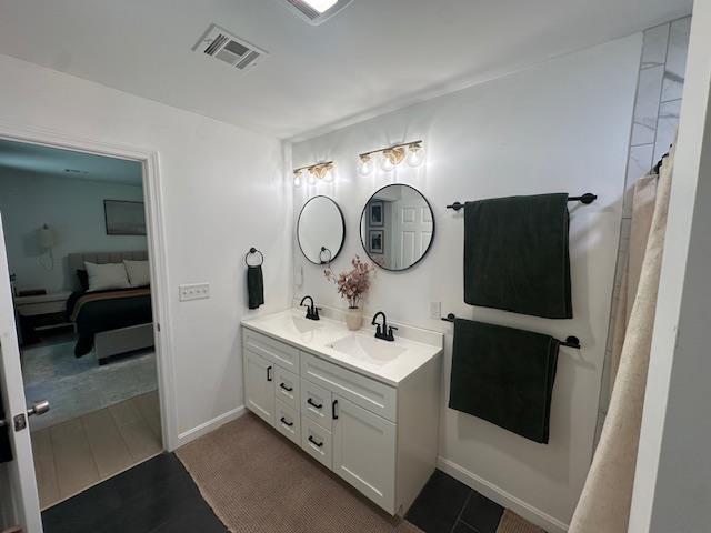 106 Betts Rd, Rochester, NH 03867 - full bath featuring double vanity, ensuite bath, and baseboards