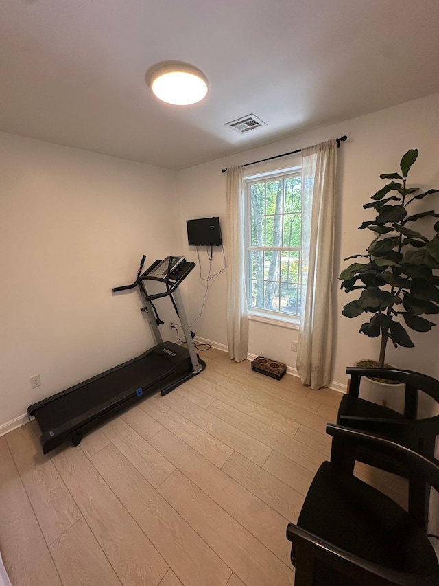 106 Betts Rd, Rochester, NH 03867 - exercise area with light wood-style flooring and baseboards