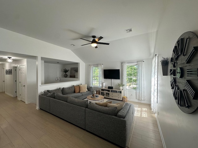 106 Betts Rd, Rochester, NH 03867 - living area with vaulted ceiling, baseboards, wood finished floors, and ceiling fan