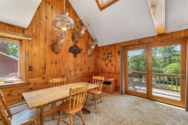 222 Main St, Alton, NH 03809 - dining room with lofted ceiling, plenty of natural light, light carpet, wooden walls, and baseboard heating