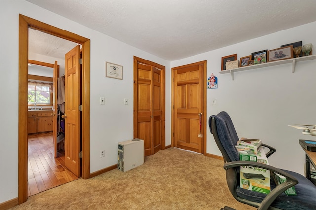 222 Main St, Alton, NH 03809 - carpeted office featuring baseboards and a sink