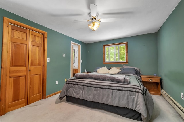 222 Main St, Alton, NH 03809 - carpeted bedroom with baseboard heating, baseboards, a ceiling fan, and ensuite bathroom