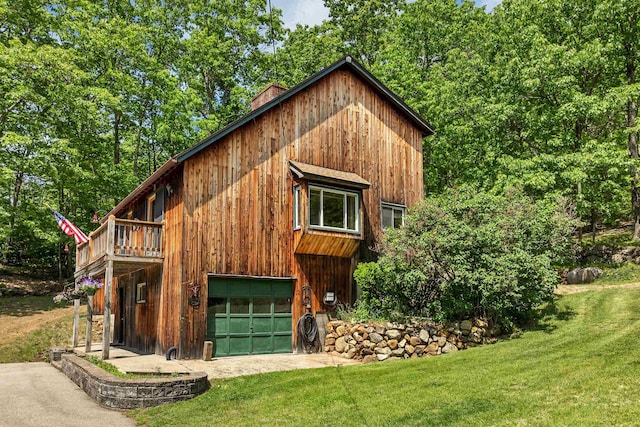 222 Main St, Alton, NH 03809 - view of side of property featuring a lawn, a chimney, and a deck