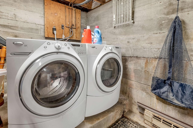 222 Main St, Alton, NH 03809 - washroom featuring washing machine and clothes dryer and a baseboard heating unit