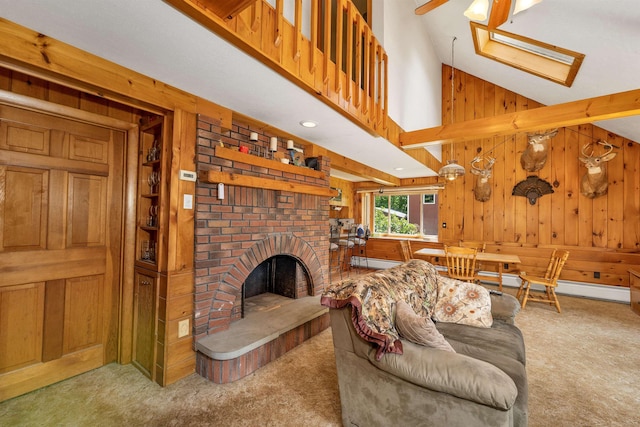 222 Main St, Alton, NH 03809 - carpeted living area with wood walls, a fireplace, baseboard heating, and high vaulted ceiling