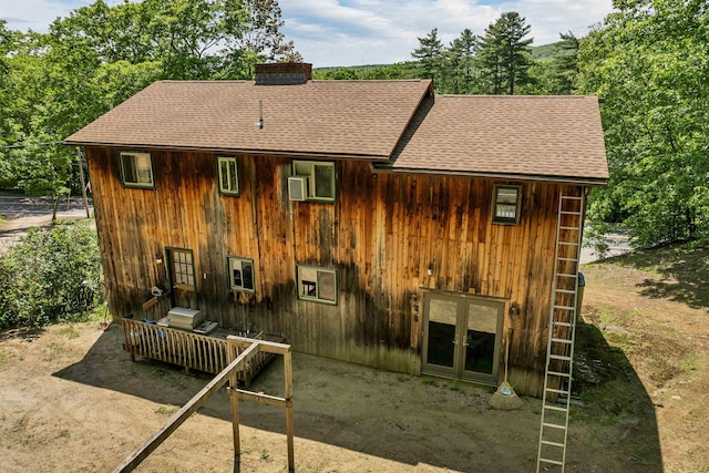 222 Main St, Alton, NH 03809 - rear view of property featuring a shingled roof, french doors, and a chimney