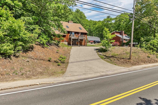 222 Main St, Alton, NH 03809 - view of front of home with a chimney