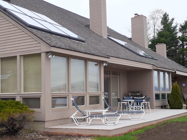 11 Portside Dr Unit 5, Moultonborough, NH 03254 - rear view of property with a chimney and roof with shingles