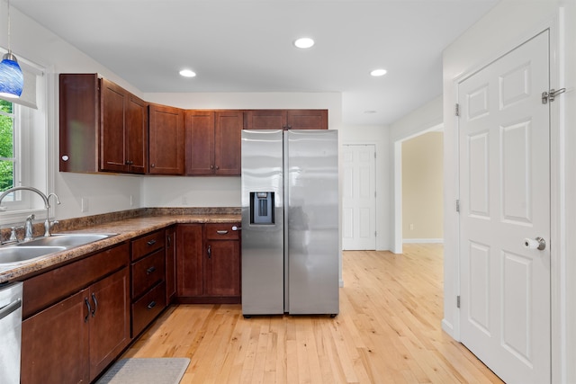 33 Thatcher Way, Barrington, NH 03825 - kitchen with appliances with stainless steel finishes, a sink, light wood-style floors, recessed lighting, and dark countertops