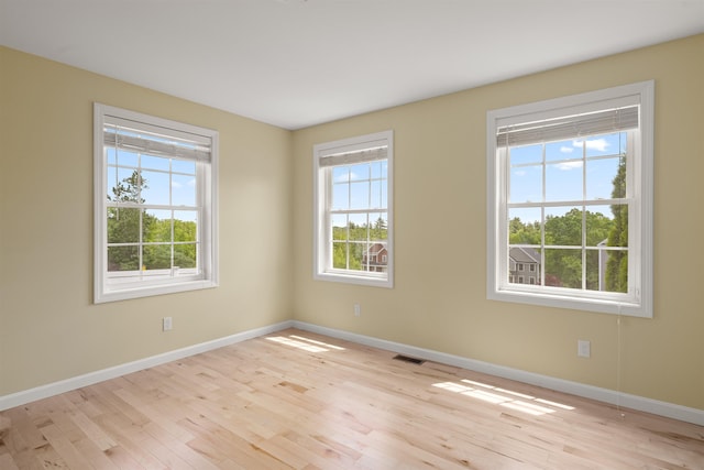33 Thatcher Way, Barrington, NH 03825 - empty room featuring baseboards and hardwood / wood-style floors