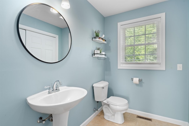 33 Thatcher Way, Barrington, NH 03825 - half bath featuring baseboards, toilet, tile patterned flooring, and a sink