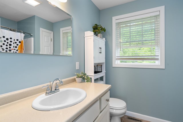 33 Thatcher Way, Barrington, NH 03825 - bathroom featuring toilet, vanity, curtained shower, and baseboards